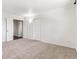 Spacious bedroom with neutral carpet and white trim, featuring multiple closets for ample storage at 3762 S Fenton Way, Denver, CO 80235