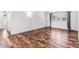 Large empty bedroom with hardwood floors, white walls and a large window at 3762 S Fenton Way, Denver, CO 80235