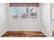 Cozy dining area with wood floors illuminated by a window overlooking the outside at 3762 S Fenton Way, Denver, CO 80235