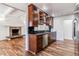 Modern kitchen featuring wood floors, stainless steel appliances, granite countertops, and ample cabinetry at 3762 S Fenton Way, Denver, CO 80235