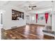 Sun-filled living room boasting wood floors, a fireplace, and vaulted ceilings perfect for relaxation at 3762 S Fenton Way, Denver, CO 80235