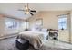 Spacious main bedroom with vaulted ceilings, ample natural light, and neutral decor at 9990 Jasper St, Commerce City, CO 80022