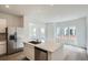Bright, open concept kitchen with stainless steel appliances and spacious island at 15277 Fillmore St, Thornton, CO 80602