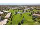 Aerial view features well-manicured golf course with surrounding residential buildings at 9300 E Center Ave # 2B, Denver, CO 80247