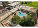 Aerial of community amenities, showcasing pool, green spaces, and shuffleboard at 9300 E Center Ave # 2B, Denver, CO 80247