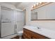 Updated bathroom with new vanity, mirror, sink, and shower at 9300 E Center Ave # 2B, Denver, CO 80247