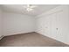 Neutral bedroom featuring ample closet space and carpeted floors at 9300 E Center Ave # 2B, Denver, CO 80247