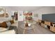 Bright living room featuring modern furnishings, adjacent kitchen, and neutral decor at 9300 E Center Ave # 2B, Denver, CO 80247