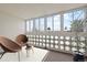 Cozy sunroom features comfortable seating and natural light from the surrounding windows at 9300 E Center Ave # 2B, Denver, CO 80247
