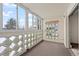 Bright sunroom with multiple windows and a view is adjacent to the living area at 9300 E Center Ave # 2B, Denver, CO 80247
