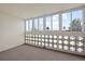 Spacious sunroom with views and privacy latticework is bathed in natural light at 9300 E Center Ave # 2B, Denver, CO 80247