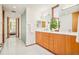 A bathroom featuring double sink vanity, hardwood cabinets, and a separate walk-in shower at 1188 S Sherman St, Denver, CO 80210