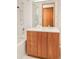 Clean bathroom featuring wood vanity with sleek fixtures and a subway-tiled shower-tub combo at 1188 S Sherman St, Denver, CO 80210