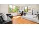 Bright bedroom with oversized windows, modern furniture, and hardwood floors at 1188 S Sherman St, Denver, CO 80210