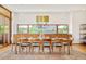 A spacious dining room with lots of natural light, a large window, and an 8-chair dining table at 1188 S Sherman St, Denver, CO 80210