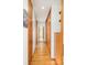 Hallway with sleek wooden storage cabinets and hardwood floors throughout the home at 1188 S Sherman St, Denver, CO 80210