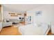Inviting living space with light gray sectional, desk area, and cozy queen size bed at 1188 S Sherman St, Denver, CO 80210