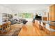 Spacious living area featuring a piano, hardwood floors, and stylish contemporary design at 1188 S Sherman St, Denver, CO 80210