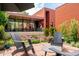 Back patio features outdoor seating, landscaped garden beds and modern brick home exterior at 1188 S Sherman St, Denver, CO 80210