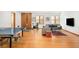 Recreation room with a ping pong table, exercise bike, and comfortable seating area at 1188 S Sherman St, Denver, CO 80210