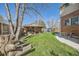 Backyard featuring a covered patio, a grill, and plenty of green space at 3777 Newton St, Denver, CO 80211