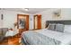 Open bedroom layout with access to walk-in closet and sitting area with hardwood floors at 3777 Newton St, Denver, CO 80211