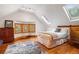 A cozy bedroom features a window seat and skylights, offering ample natural light at 3777 Newton St, Denver, CO 80211