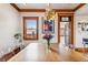 Inviting dining room featuring a modern light fixture and natural wood trim at 3777 Newton St, Denver, CO 80211