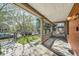 Cozy front porch with a swing, wood flooring, and views of the landscaped front yard at 3777 Newton St, Denver, CO 80211