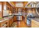 A bright kitchen featuring stainless steel appliances, custom wood cabinets, and a wood ceiling at 3777 Newton St, Denver, CO 80211