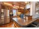 Bright kitchen featuring stainless steel appliances, a wine fridge and custom wood cabinets at 3777 Newton St, Denver, CO 80211