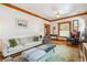 Bright living room with hardwood floors, modern furniture, and a cozy atmosphere at 3777 Newton St, Denver, CO 80211