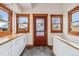 Mudroom entry area featuring white cabinets and plenty of light at 3777 Newton St, Denver, CO 80211
