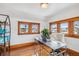 Home office featuring hardwood floors, natural light, and modern desk at 3777 Newton St, Denver, CO 80211