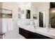 Modern bathroom featuring double sinks, sleek mirrors, and contemporary design at 1932 W 32Nd Ave, Denver, CO 80211