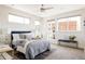 Sunlit bedroom with a ceiling fan and comfortable furnishings at 1932 W 32Nd Ave, Denver, CO 80211