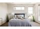Well-lit bedroom with stylish decor, large windows, and a comfortable bed at 1932 W 32Nd Ave, Denver, CO 80211