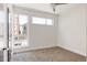 Bright bedroom with ample natural light and neutral carpeting at 1932 W 32Nd Ave, Denver, CO 80211