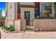 Modern townhome with brick accents, a small gated front yard, and landscaped features at 1932 W 32Nd Ave, Denver, CO 80211