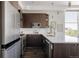 Well-equipped kitchen with stainless steel appliances, granite countertops, and lots of natural light at 1932 W 32Nd Ave, Denver, CO 80211