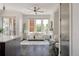 Open concept living room featuring a fireplace, large windows, and hardwood floors at 1932 W 32Nd Ave, Denver, CO 80211