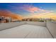 A spacious rooftop deck offers city views and an open space for relaxation and entertainment at 1932 W 32Nd Ave, Denver, CO 80211
