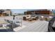 Stylish rooftop deck furnished with a dining set, seating, and city views in the background at 1932 W 32Nd Ave, Denver, CO 80211