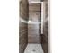 Modern shower featuring stylish tile work, a rainfall shower head, and sleek fixtures at 1932 W 32Nd Ave, Denver, CO 80211