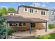 Exterior of a two-story home featuring a covered patio and a well-maintained backyard at 2601 Pemberly Ave, Highlands Ranch, CO 80126