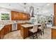 Spacious kitchen featuring an island with a gas cooktop and stainless steel appliances at 2601 Pemberly Ave, Highlands Ranch, CO 80126