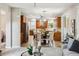 Open-concept kitchen with cherry cabinets, stainless steel appliances, granite countertops, and a cozy breakfast nook at 2601 Pemberly Ave, Highlands Ranch, CO 80126