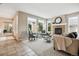 Inviting living room with a fireplace, plush seating, and large windows that flood the space with natural light at 2601 Pemberly Ave, Highlands Ranch, CO 80126