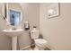 Stylish powder room with a pedestal sink and decorative accents at 4027 E Geddes Cir, Centennial, CO 80122