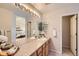 Well-lit bathroom with double sinks and a large mirror at 4027 E Geddes Cir, Centennial, CO 80122